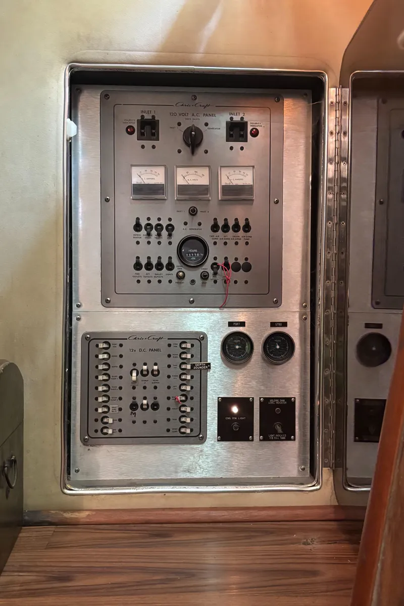 Slide: The Image of Control panel of 1986 Chris-Craft 381 Catalina boat with gauges and switches. - 43