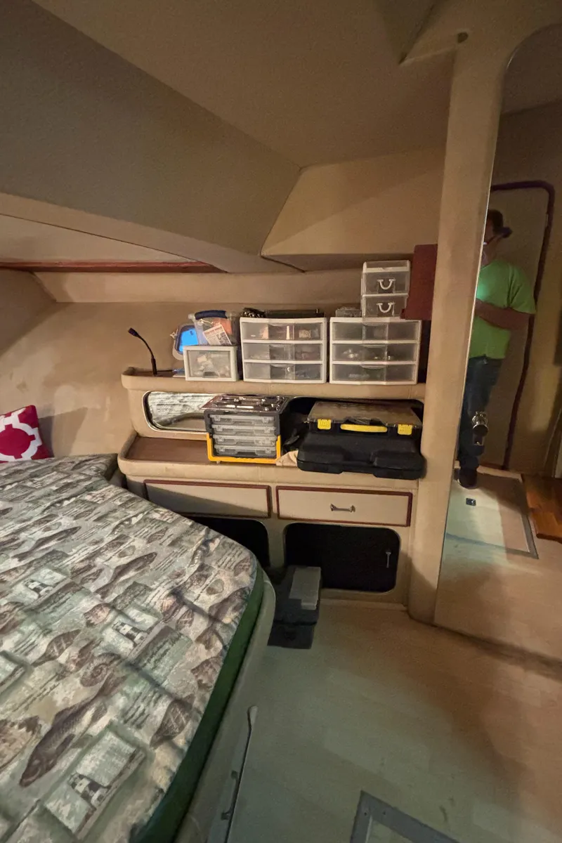 Slide: The Image of 1986 Chris-Craft 381 Catalina cabin interior with storage and bed. - 45