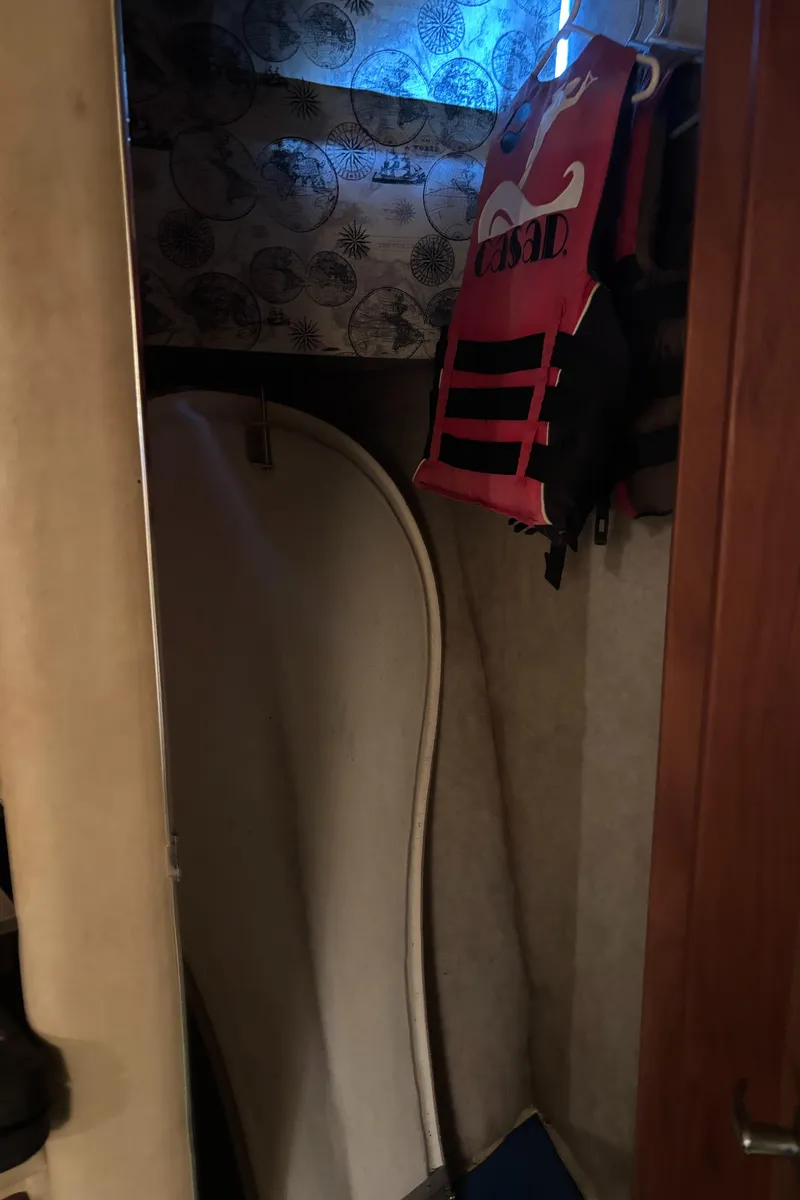 Slide: The Image of Interior of 1986 Chris-Craft 381 Catalina with life jacket and surfboard. - 46