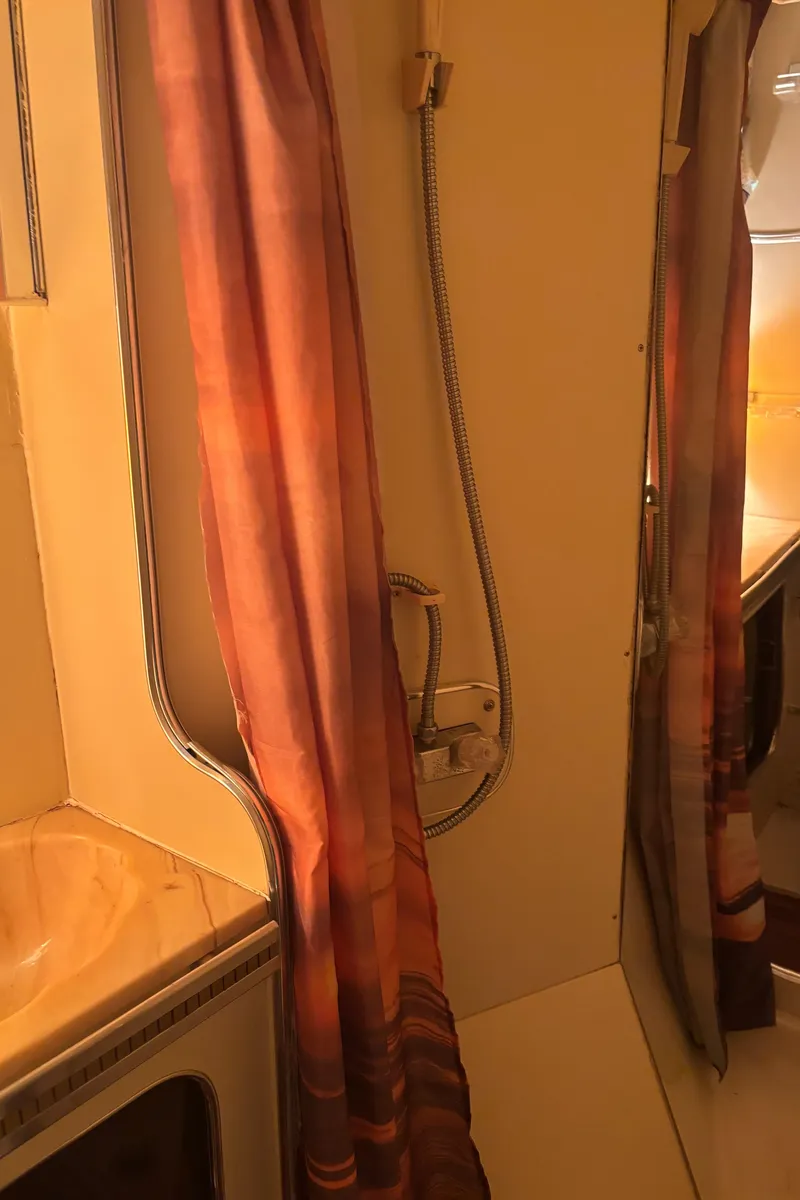 Slide: The Image of 1986 Chris-Craft 381 Catalina bathroom with shower and curtain. - 49