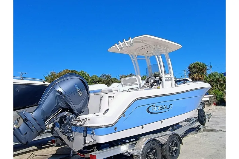 Slide: The Image of 2025 Robalo R222 Center Console boat on trailer, featuring Yamaha outboard motor. - 4