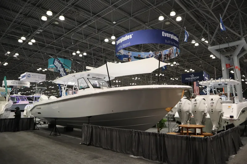 The Image of 2025 Everglades 395 Center Console boat displayed at an indoor exhibition. - 0