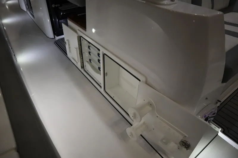 Slide: The Image of 2025 Everglades 395 Center Console interior with storage compartments and sleek design. - 12