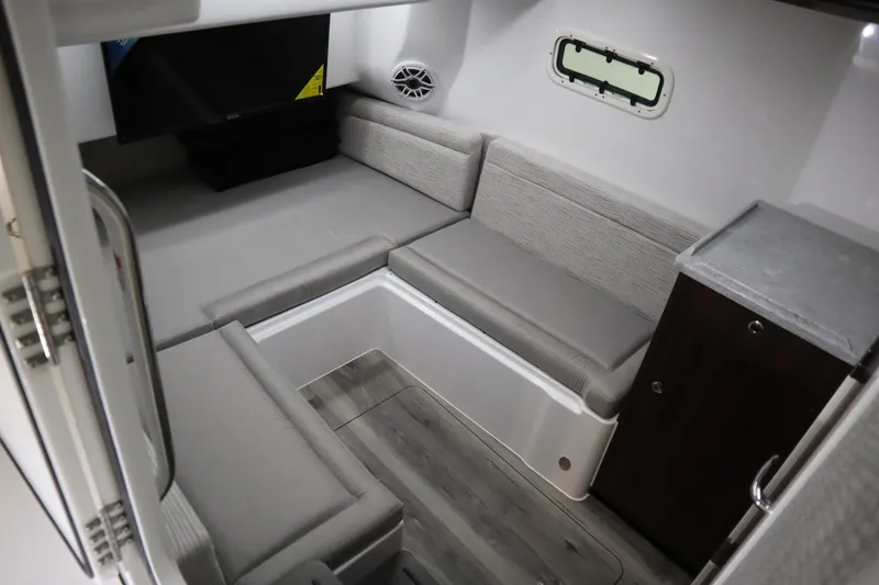 Slide: The Image of Interior of 2025 Everglades 395 Center Console boat with gray seating and wood flooring. - 16