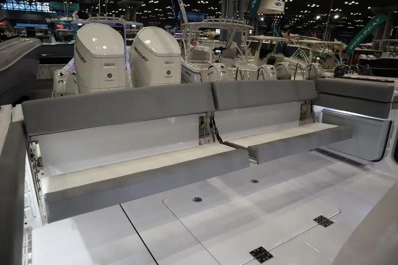 Slide: The Image of 2025 Everglades 395 Center Console boat with seating and powerful outboard engines. - 19