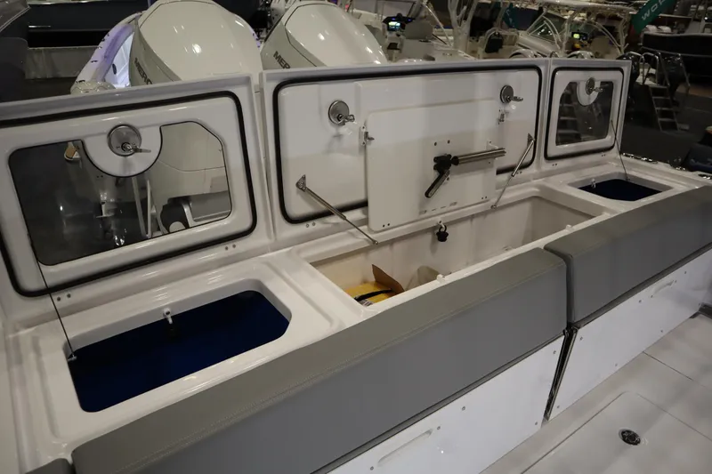 Slide: The Image of 2025 Everglades 395 Center Console boat interior with storage compartments and seating. - 20