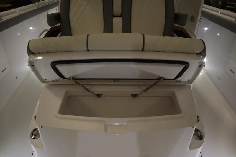 Slide: The Image of 2025 Everglades 395 Center Console boat seat with storage compartment open. - 8
