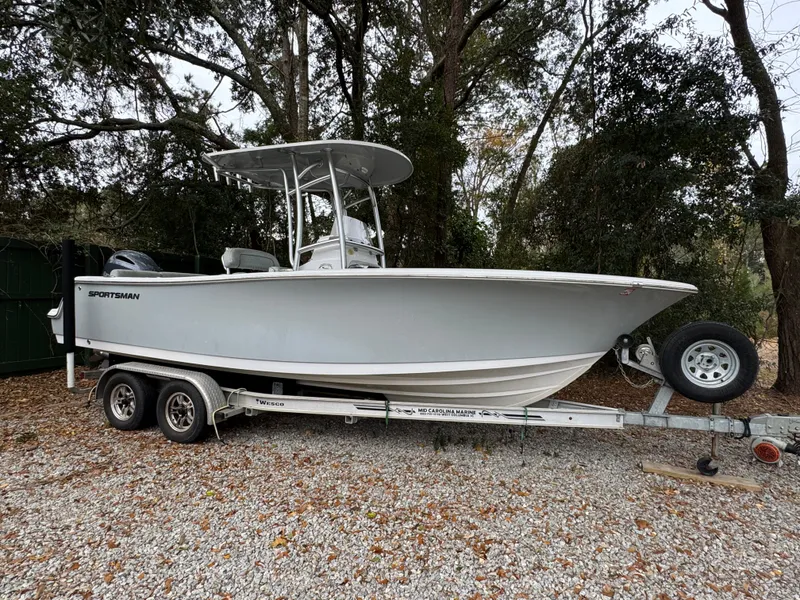 Slide: The Image of 2019 Sportsman Heritage 231 Center Console boat on trailer, parked outdoors. - 1