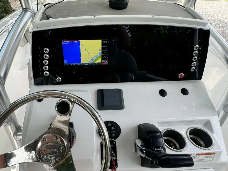 Slide: The Image of 2019 Sportsman Heritage 231 Center Console dashboard with navigation display and controls. - 6