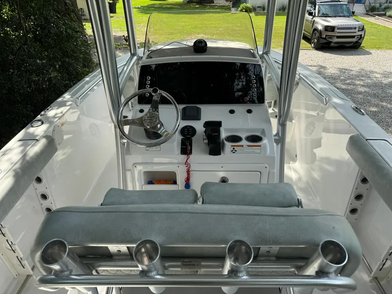 Slide: The Image of 2019 Sportsman Heritage 231 Center Console boat interior with steering wheel and controls. - 7