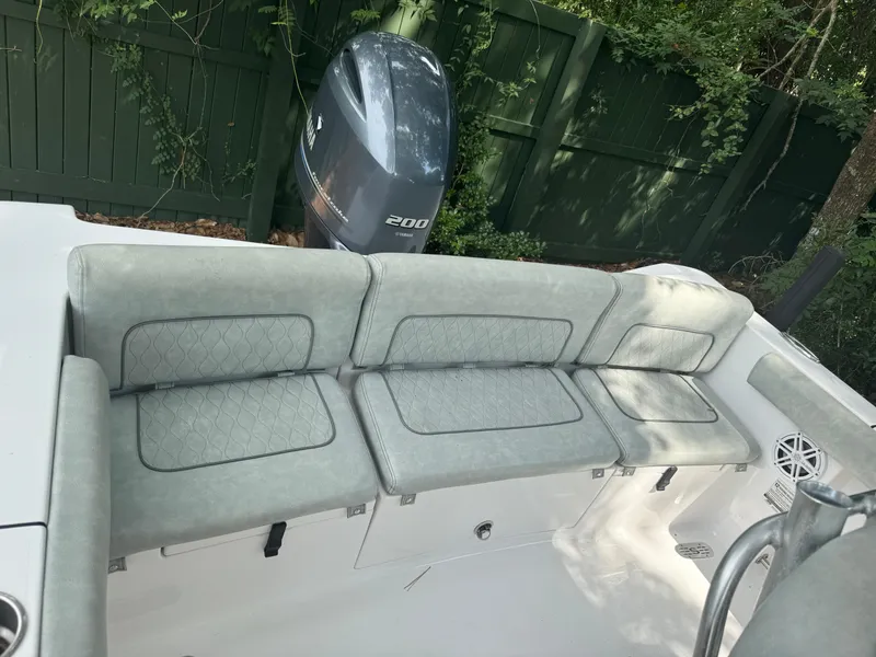 Slide: The Image of 2019 Sportsman Heritage 231 Center Console boat seating and engine view. - 9
