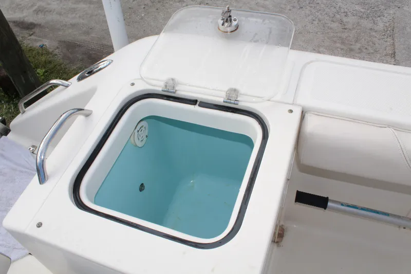 Slide: The Image of Open storage compartment on 2008 Pursuit C230 boat. - 14