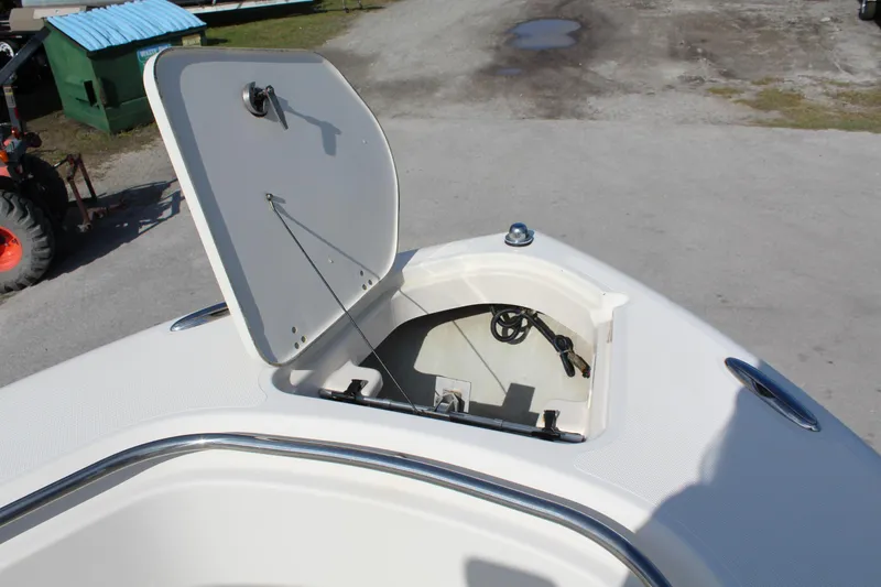Slide: The Image of Open hatch on 2008 Pursuit C230 boat, showing storage compartment. - 24