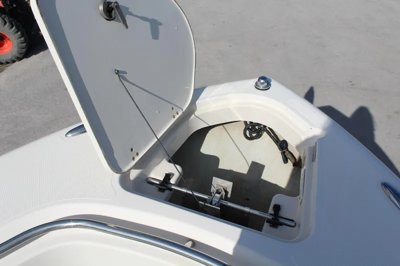 Slide: The Image of Open storage compartment on 2008 Pursuit C230 boat deck. - 25