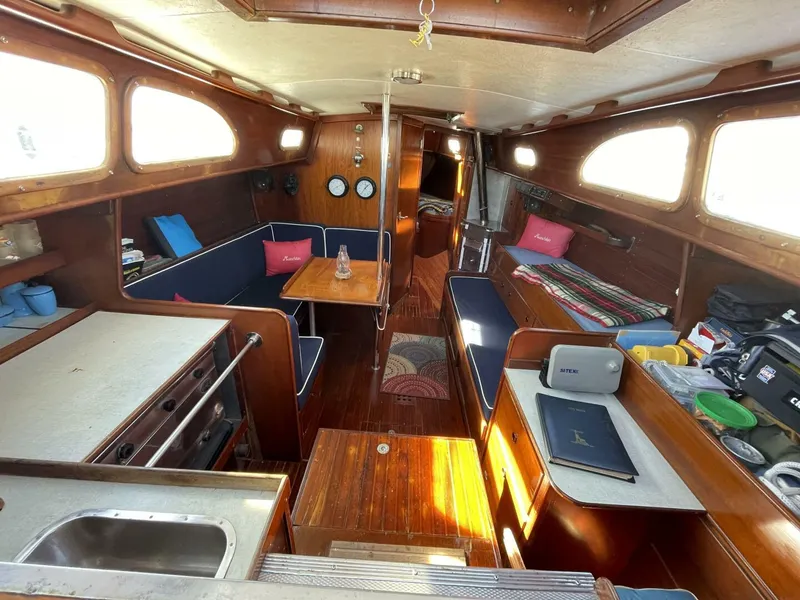 Slide: The Image of Interior of 1968 LeComte Northeast 38 sailboat with wood finish and cozy seating area. - 12