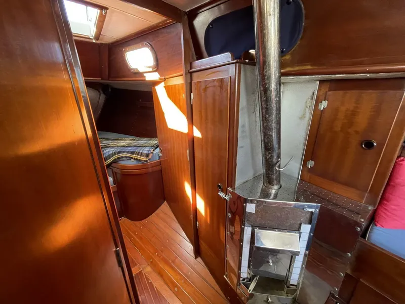 Slide: The Image of Interior of 1968 LeComte Northeast 38 sailboat with wood paneling and cozy cabin. - 20