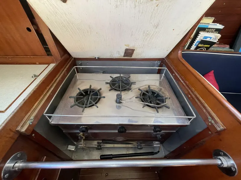 Slide: The Image of Vintage 1968 LeComte Northeast 38 yacht stove with three burners in wooden cabin interior. - 24