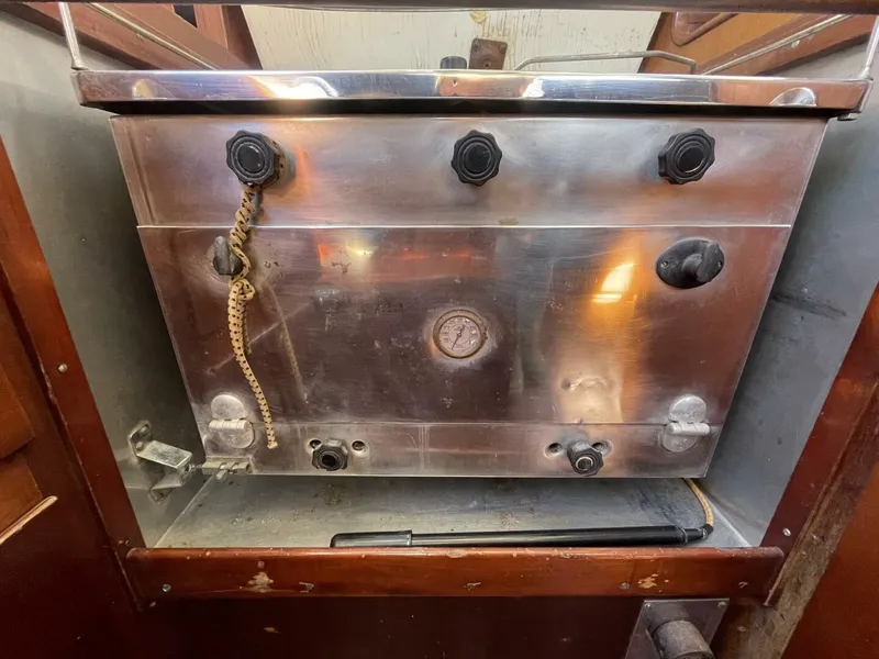 Slide: The Image of Vintage 1968 LeComte Northeast 38 boat stove with metal finish and control knobs. - 25