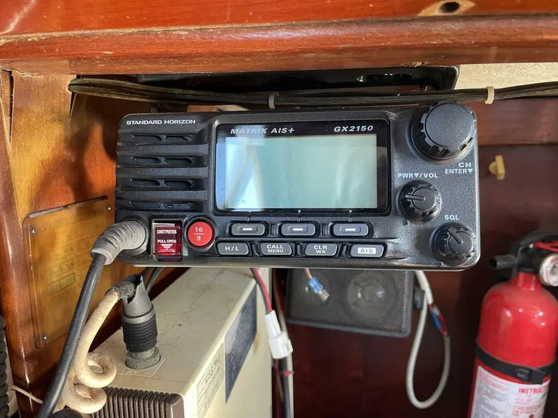 Slide: The Image of Marine radio equipment on 1968 LeComte Northeast 38 sailboat, featuring Standard Horizon Matrix AIS+ GX2150. - 28