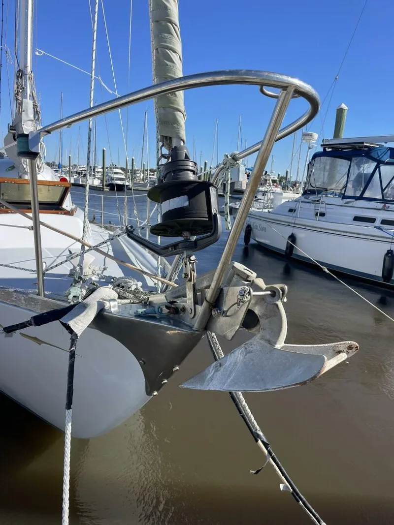 Slide: The Image of 1968 LeComte Northeast 38 sailboat anchored in marina, clear blue sky. - 43