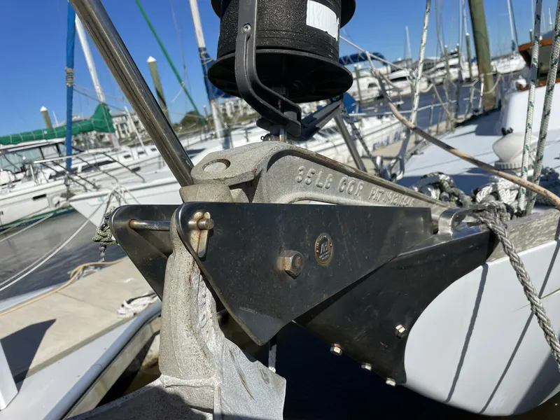 Slide: The Image of Close-up of a 1968 LeComte Northeast 38 sailboat anchor mechanism at a marina. - 44