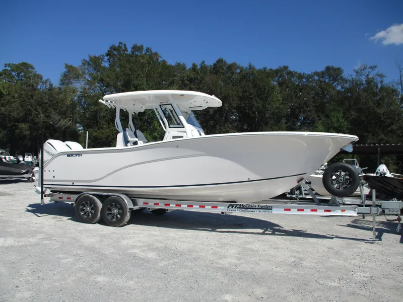 The Image of 2025 Sea Fox 288 Commander boat on trailer, parked outdoors. - 1