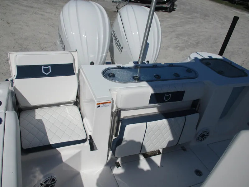 Slide: The Image of 2025 Sea Fox 288 Commander boat interior with Yamaha engines, featuring cushioned seating and storage. - 12