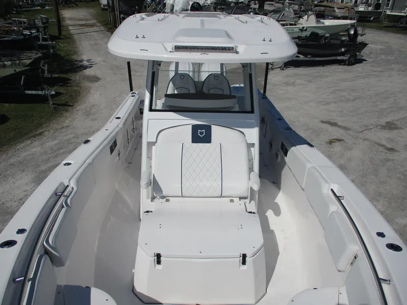 Slide: The Image of 2025 Sea Fox 288 Commander boat, spacious deck, sleek design, white interior. - 14