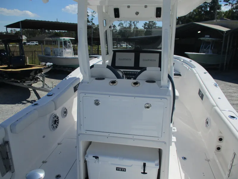 Slide: The Image of 2025 Sea Fox 288 Commander boat interior with Garmin displays and Yeti cooler. - 5
