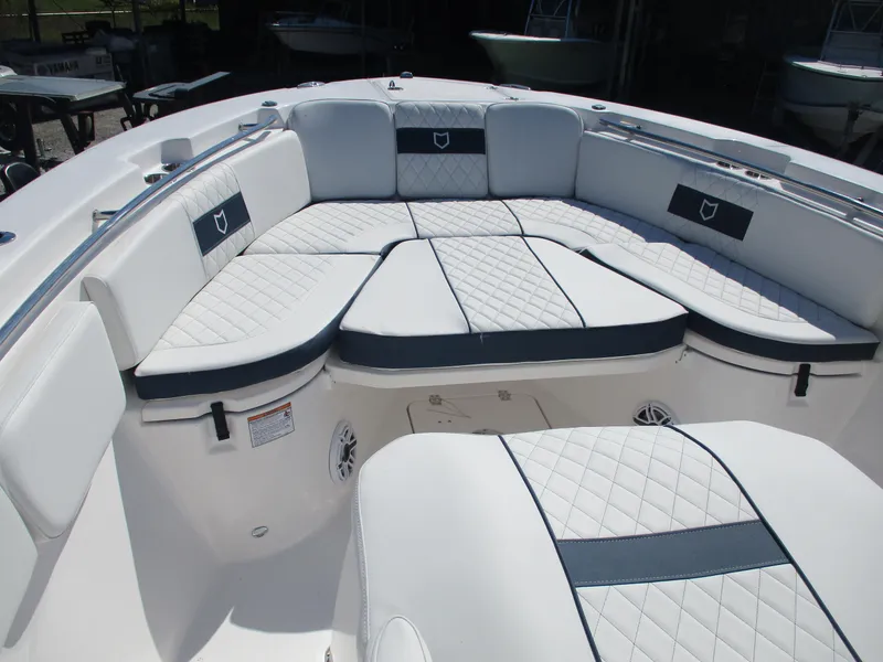 Slide: The Image of 2025 Sea Fox 288 Commander boat interior with white cushioned seating. - 7