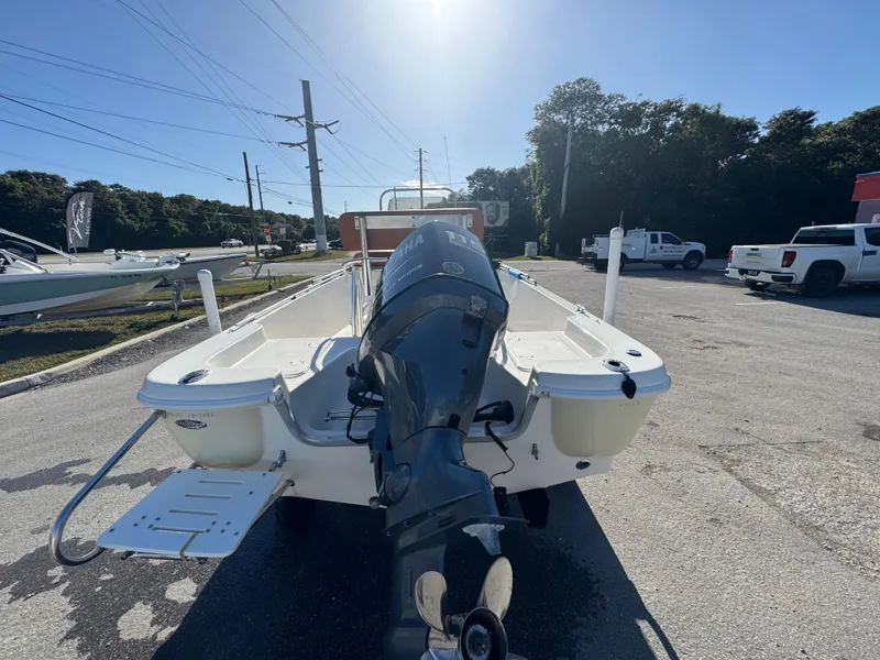 Slide: The Image of 2006 NauticStar 1800 Nautic Bay boat with outboard motor in a parking lot. - 4