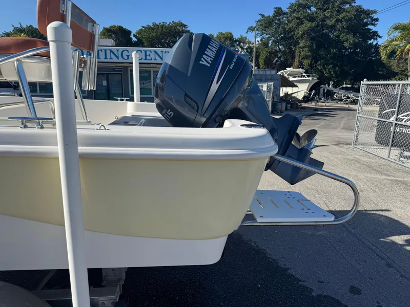 Slide: The Image of 2006 NauticStar 1800 Nautic Bay boat with Yamaha outboard motor in a marina setting. - 5