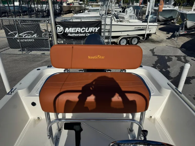 Slide: The Image of 2006 NauticStar 1800 Nautic Bay boat seat with shadow, at Mercury dealership. - 8