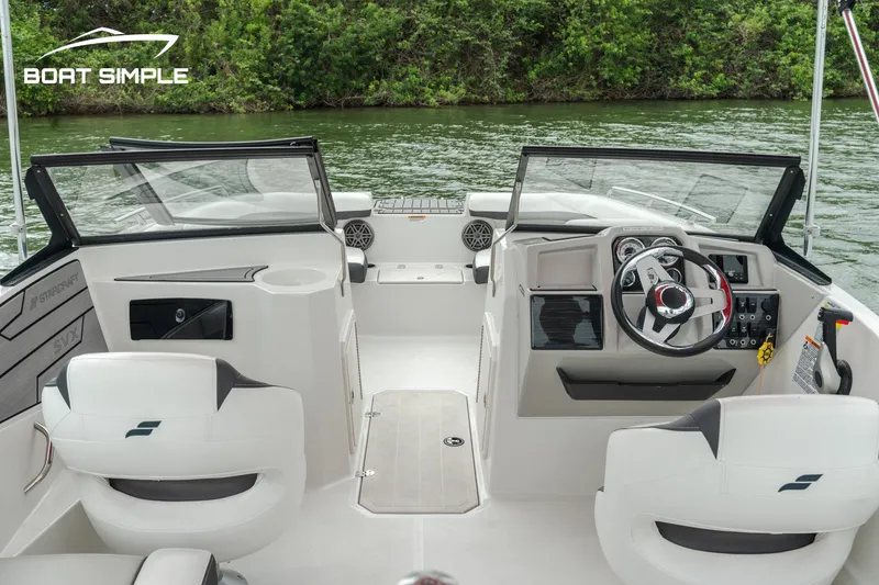 Slide: The Image of 2024 Starcraft SVX 190 OB DC boat interior with dual consoles and modern steering. - 4
