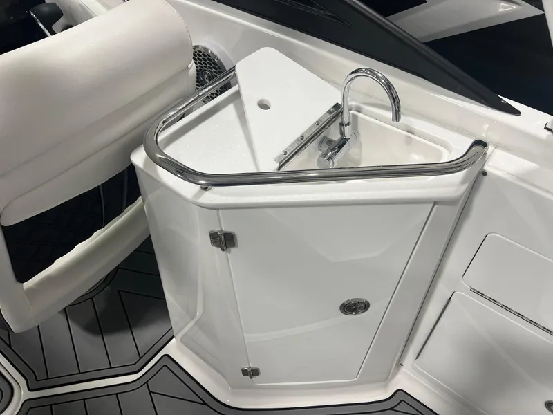 Slide: The Image of 2024 Monterey M4 boat interior with sleek white sink and storage cabinet. - 4