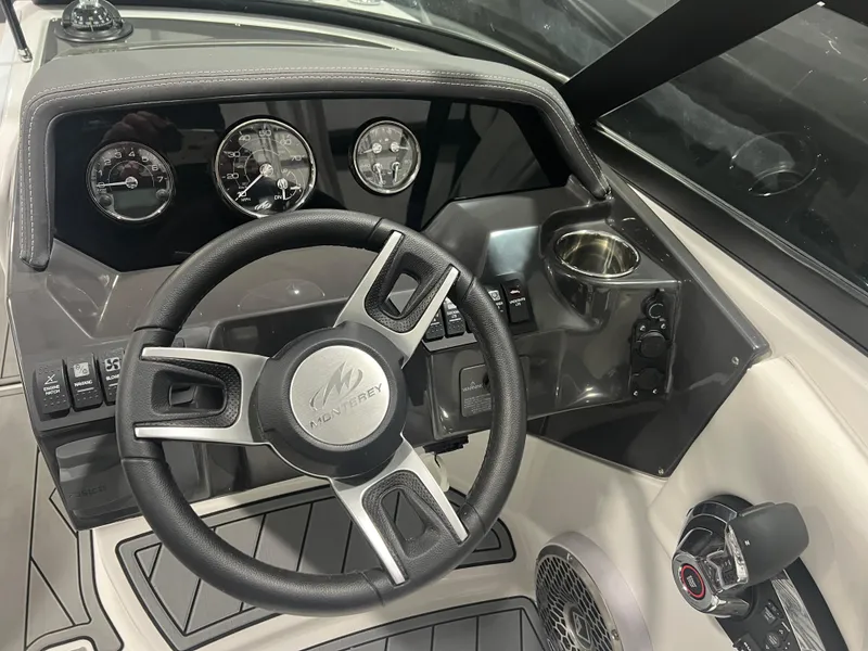 Slide: The Image of 2024 Monterey M4 boat dashboard with steering wheel and gauges. - 7
