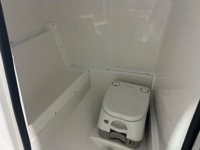Slide: The Image of 2024 Monterey M4 boat interior with compact portable toilet. - 8