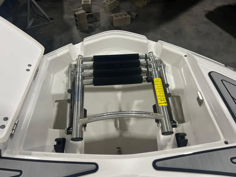 Slide: The Image of 2024 Monterey M4 boat ladder compartment with stainless steel retractable ladder. - 9