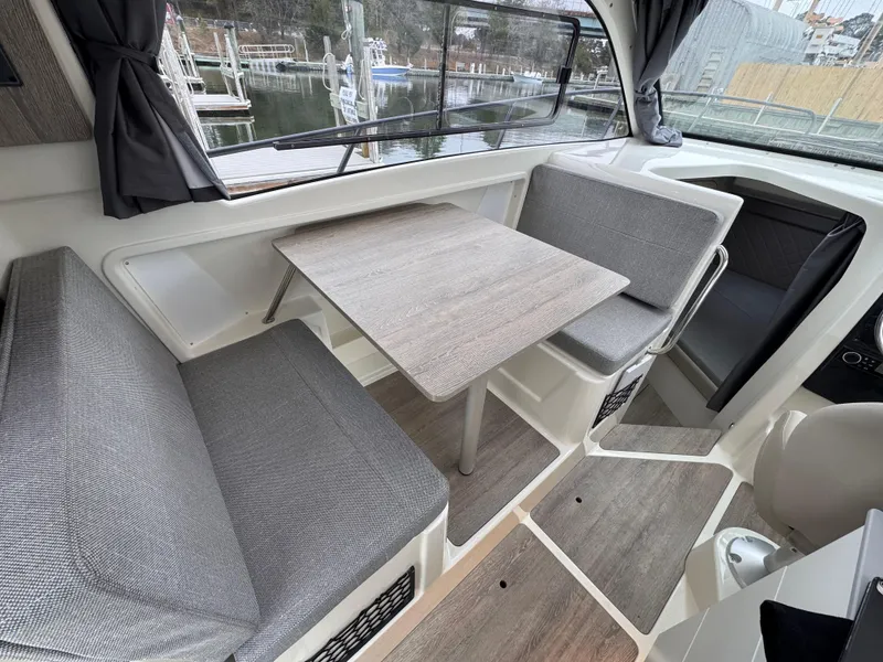 Slide: The Image of Interior of 2025 Trophy T25 Explorer boat with seating and table setup. - 10