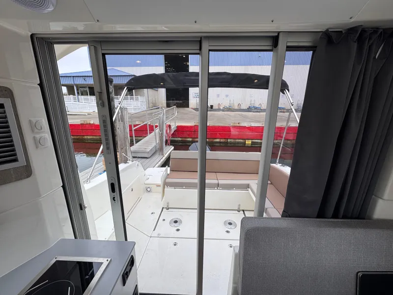 Slide: The Image of Interior view of 2025 Trophy T25 Explorer boat with sliding glass doors. - 12