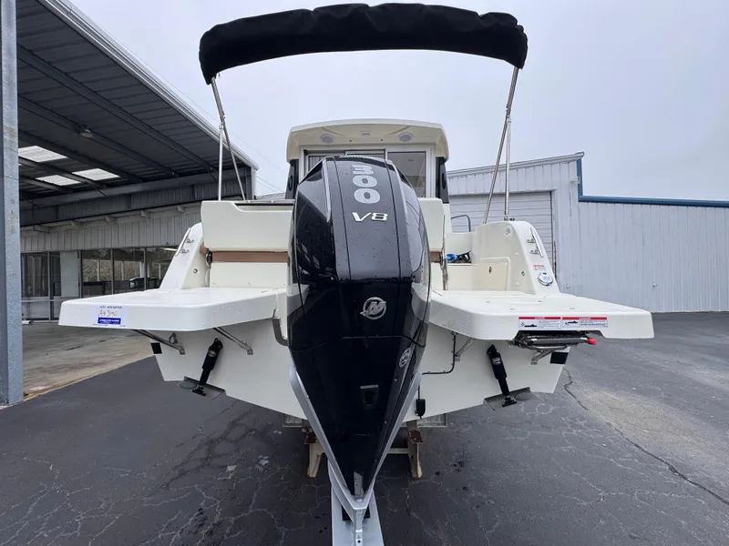 Slide: The Image of 2025 Trophy T25 Explorer boat with powerful V8 engine, parked outdoors. - 14