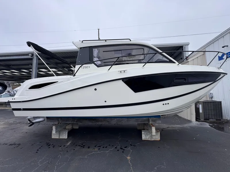 Slide: The Image of 2025 Trophy T25 Explorer boat on display in a marina setting. - 15