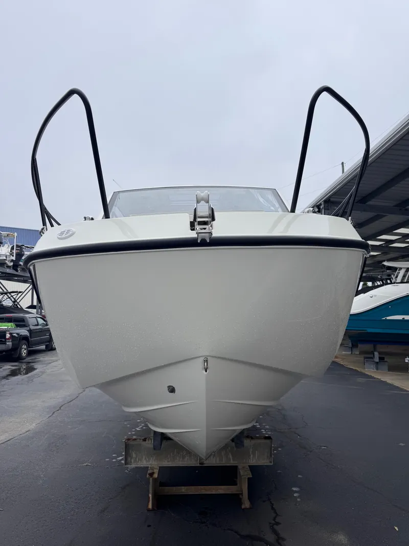 Slide: The Image of 2025 Trophy T25 Explorer boat, front view, docked on a trailer. - 17