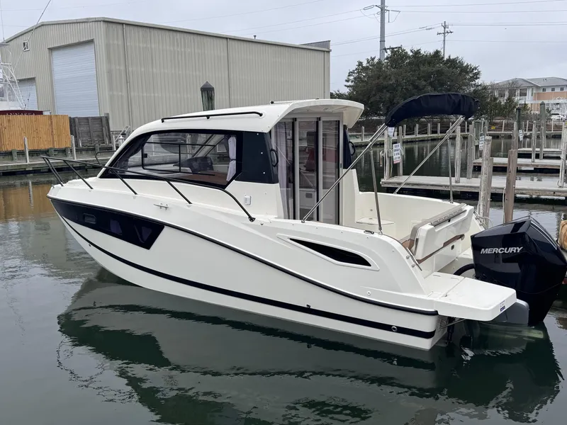 Slide: The Image of 2025 Trophy T25 Explorer boat docked in marina, featuring sleek design and Mercury outboard motor. - 3