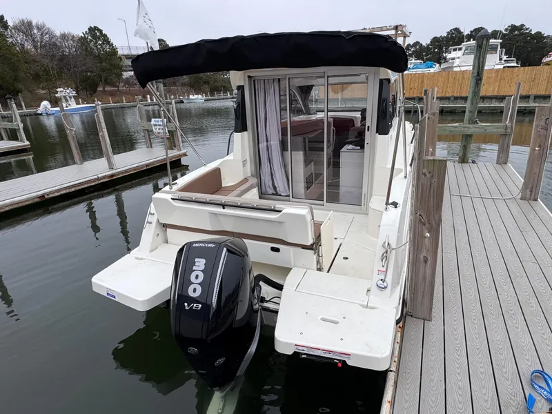 Slide: The Image of 2025 Trophy T25 Explorer boat docked, featuring a powerful V8 engine and sleek design. - 4