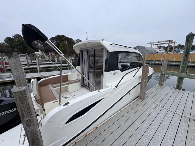 Slide: The Image of 2025 Trophy T25 Explorer boat docked at marina, side view. - 5