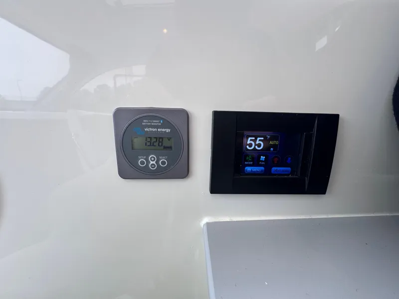 Slide: The Image of Control panel of 2025 Trophy T25 Explorer boat, featuring digital displays. - 8