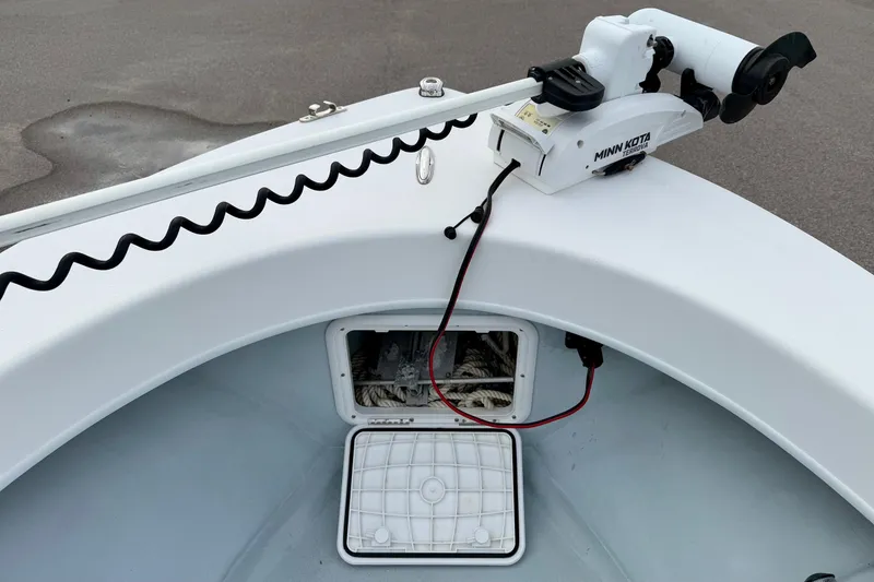 Slide: The Image of 2020 Privateer 1800 Retriever boat with Minn Kota trolling motor and storage compartment. - 13