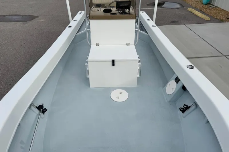 Slide: The Image of 2020 Privateer 1800 Retriever boat interior with center console and storage compartment. - 14