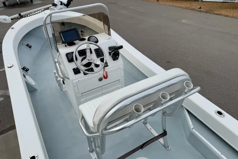 Slide: The Image of 2020 Privateer 1800 Retriever boat interior with steering console and seating. - 19